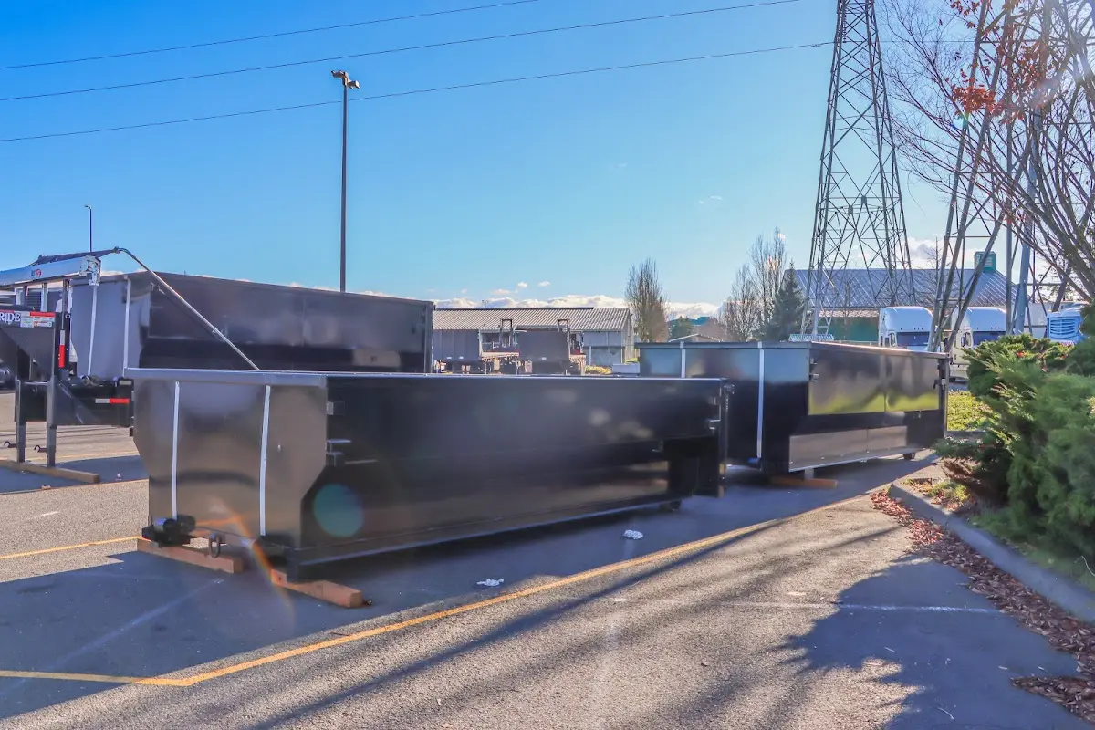 Roll-off dumpster ready for waste disposal at job site for 4 Yard Dumpster Rental in Lawrence